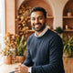 A friendly South Asian man smiling in a professional headshot, used as a customer testimonial avatar.